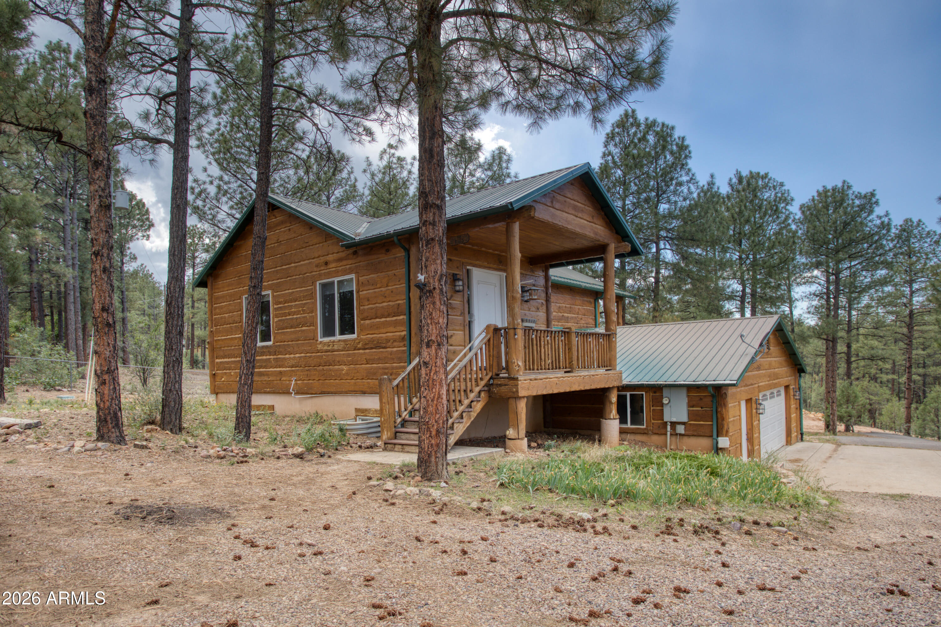 1420 Meadow View Place Show Low, AZ 85901 - Photo 24 of 25 a front view of a house with a yard and balcony