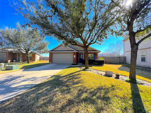 a house with trees in the background