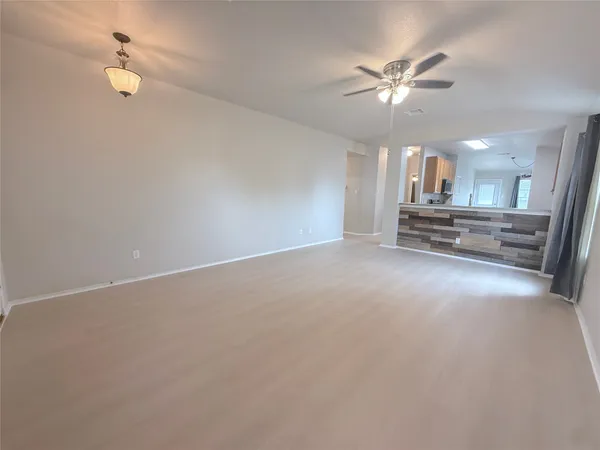 a view of a livingroom with a ceiling fan