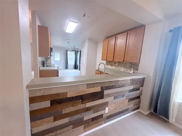 a view of room with cabinets and bed