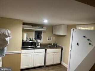 a white toilet sitting next to a bathroom sink