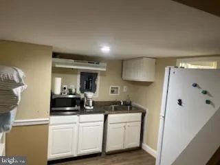 a white toilet sitting next to a bathroom sink