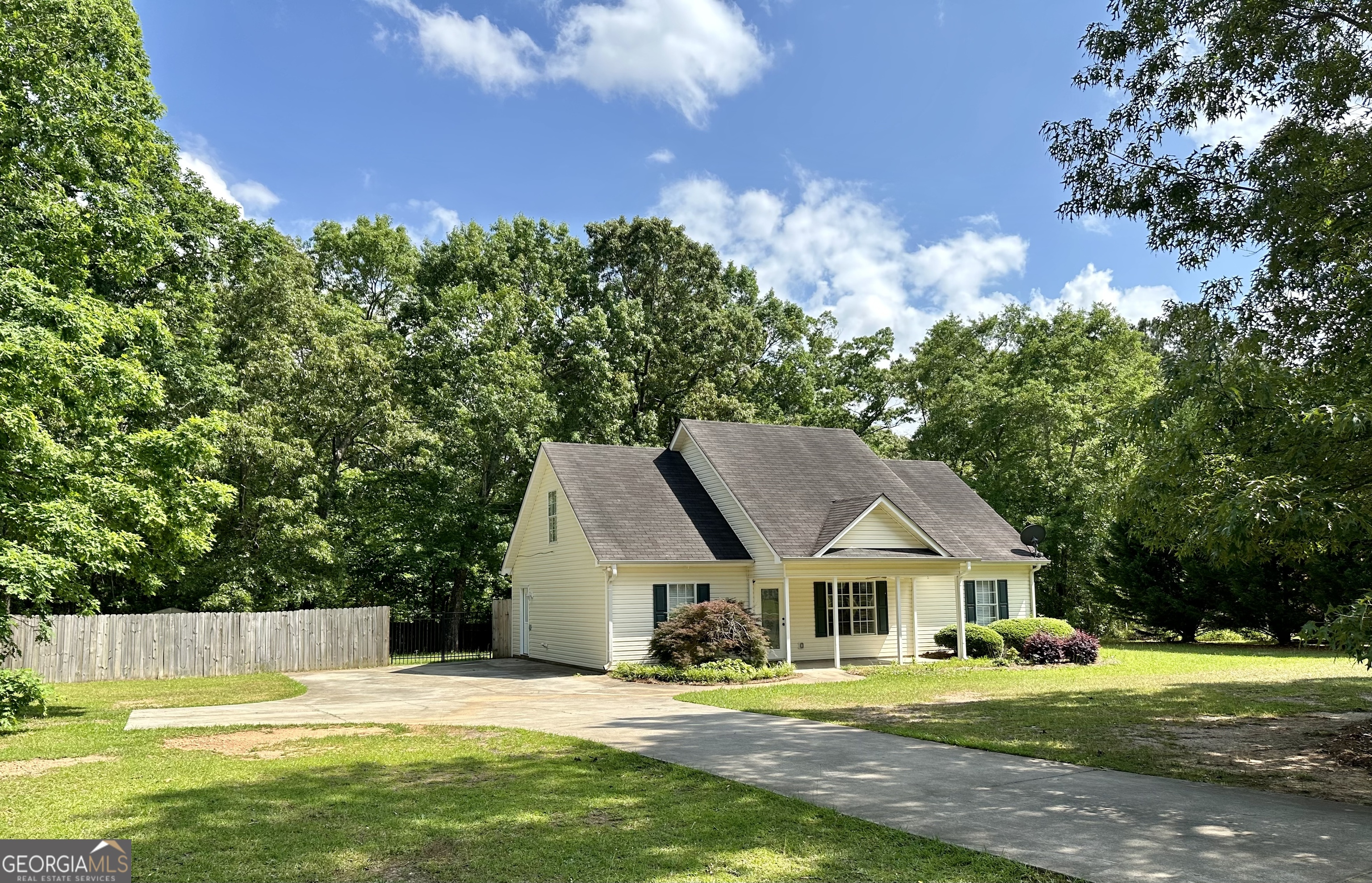 143 Ridgeway Road Milner, GA 30257 - Photo 1 of 1 a front view of a house with a yard