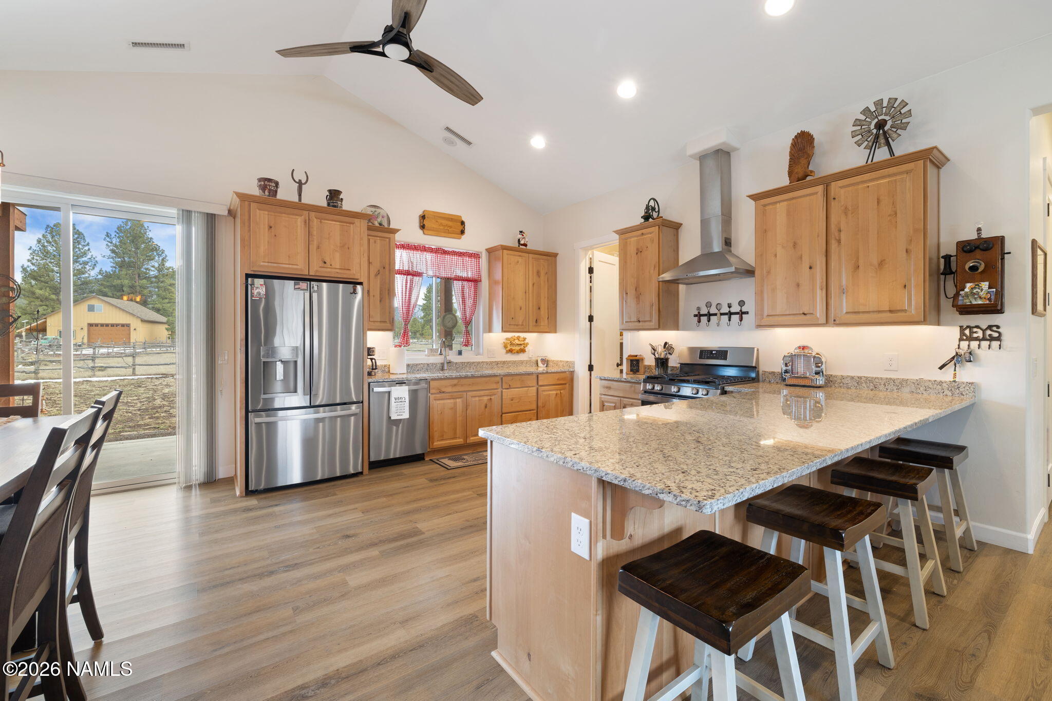 2557 Lazy E Road Williams, AZ 86046 - Photo 12 of 51 a kitchen with stainless steel appliances granite countertop a sink a stove and a refrigerator