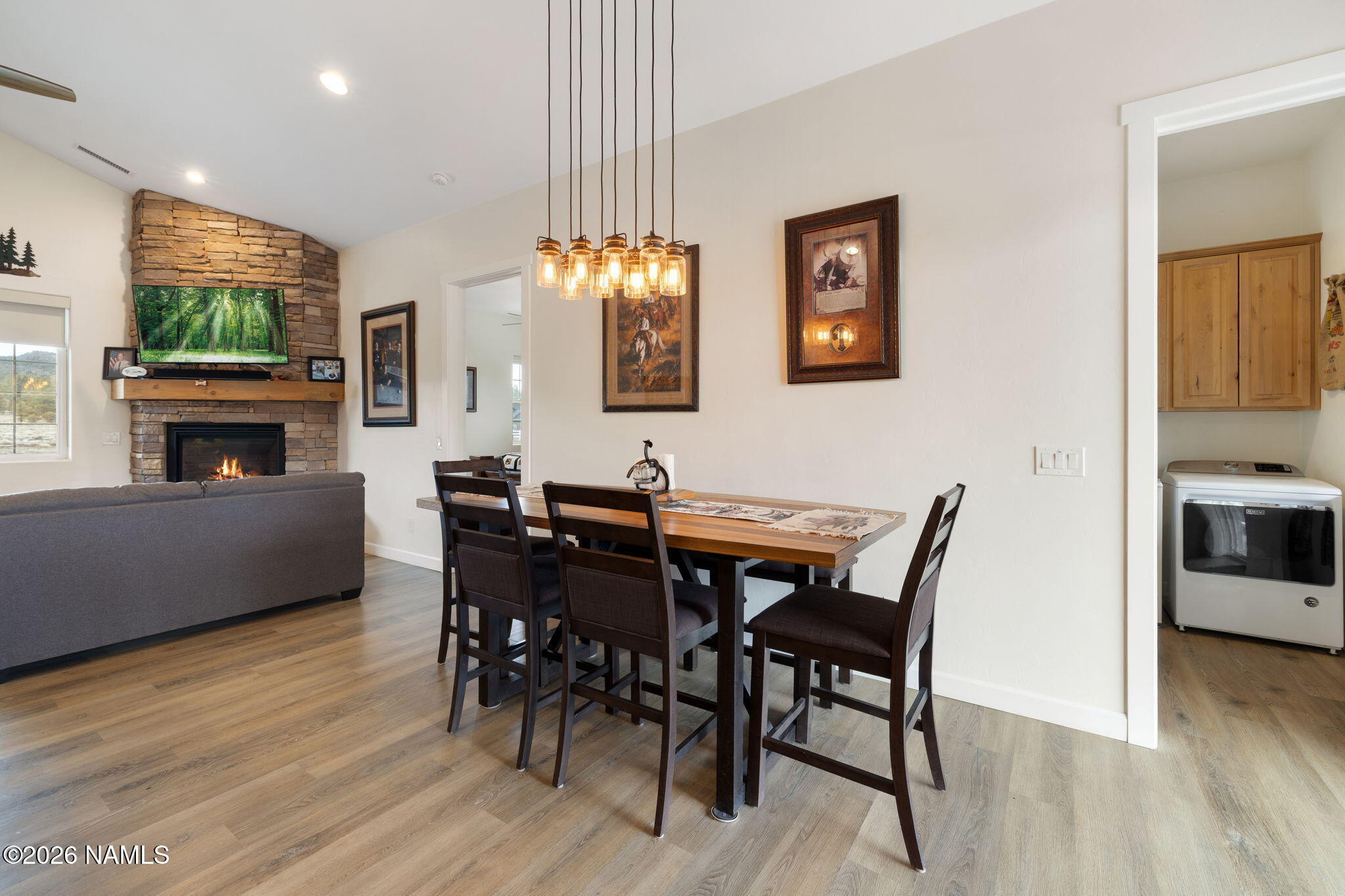 2557 Lazy E Road Williams, AZ 86046 - Photo 14 of 51 a view of a dining room with furniture window and wooden floor
