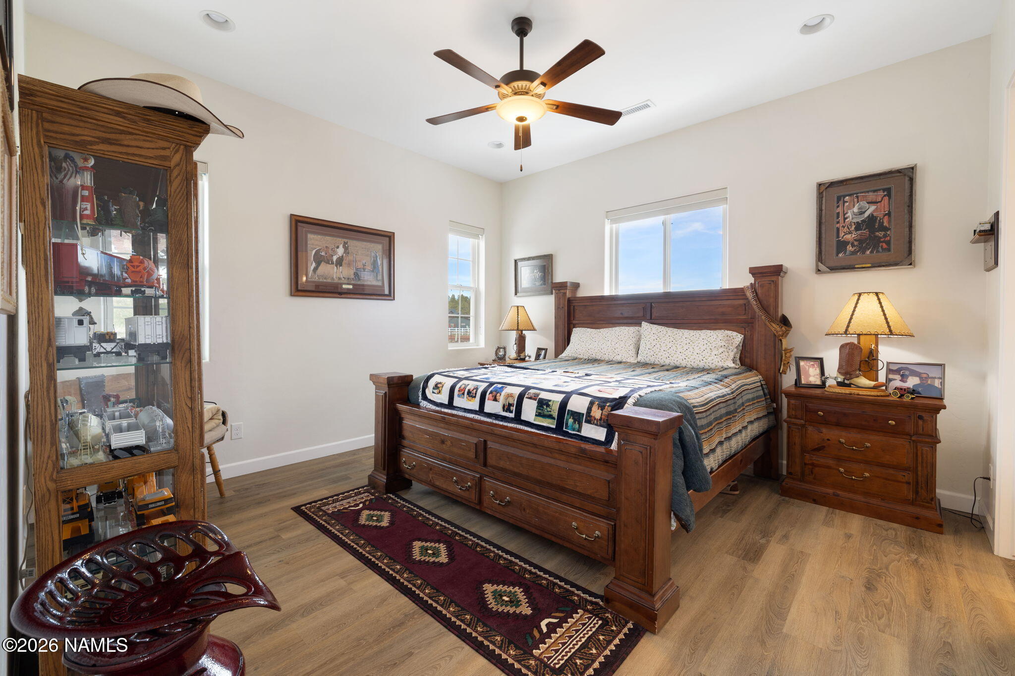 2557 Lazy E Road Williams, AZ 86046 - Photo 16 of 51 a bedroom with furniture and a lamp
