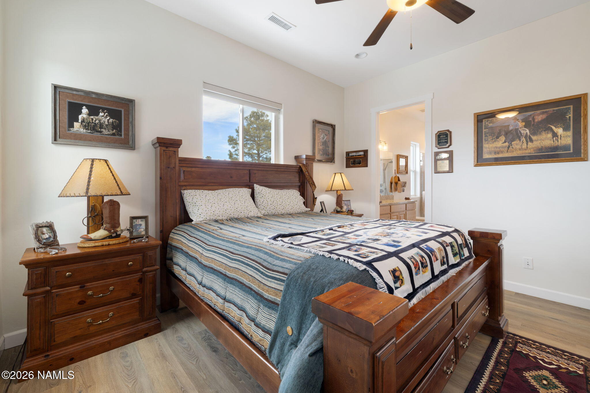 2557 Lazy E Road Williams, AZ 86046 - Photo 17 of 51 a bedroom with a bed and wooden floor