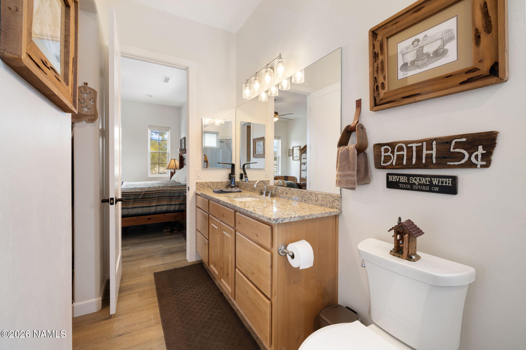 2557 Lazy E Road Williams, AZ 86046 - Photo 19 of 51 a bathroom with a sink a toilet and a mirror