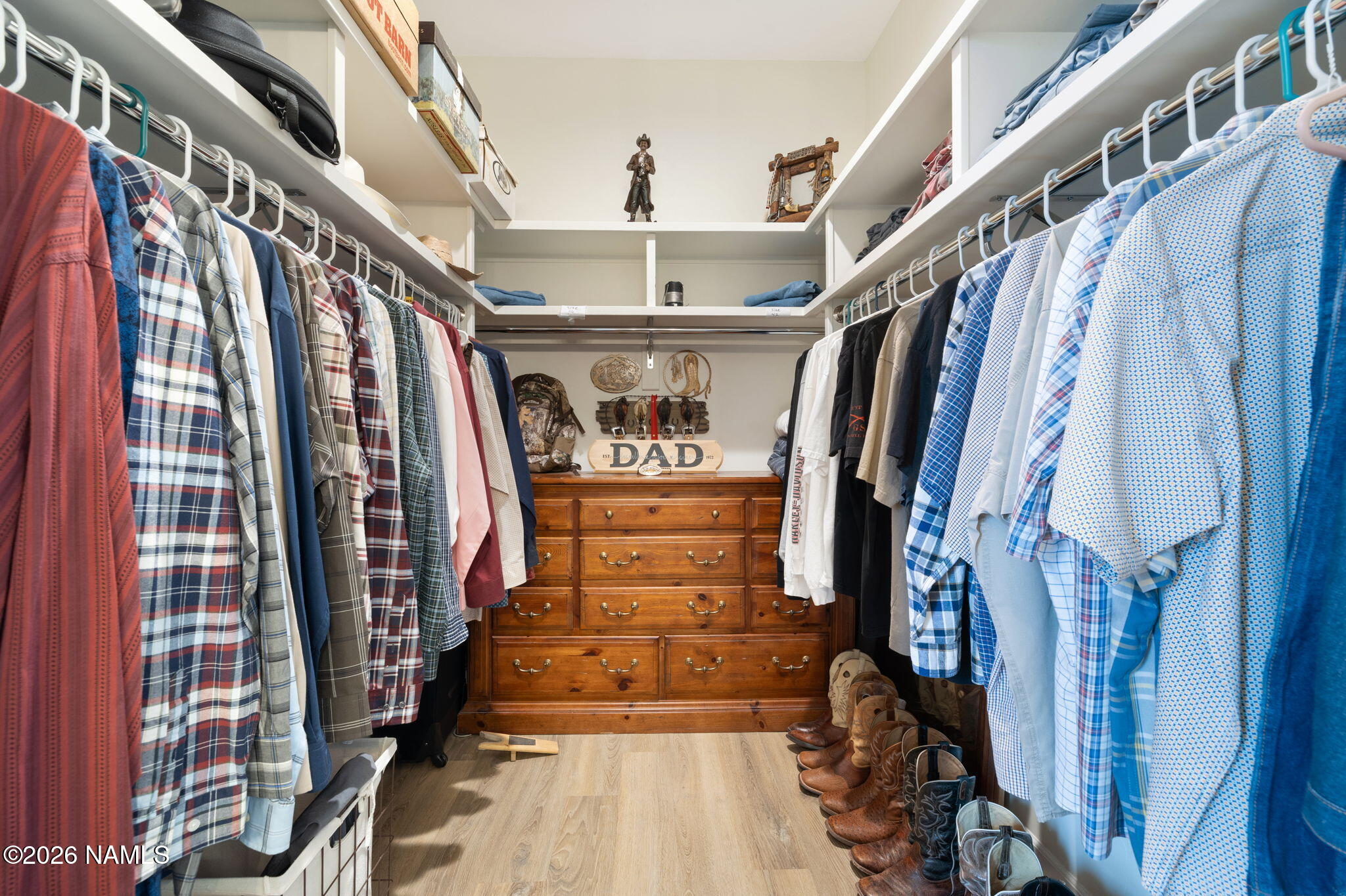 2557 Lazy E Road Williams, AZ 86046 - Photo 20 of 51 a view of walk in closet with clothes and shoes