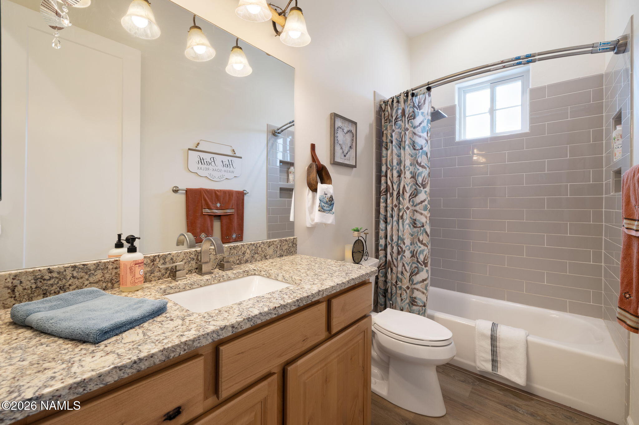 2557 Lazy E Road Williams, AZ 86046 - Photo 26 of 51 a bathroom with a granite countertop sink a toilet and shower