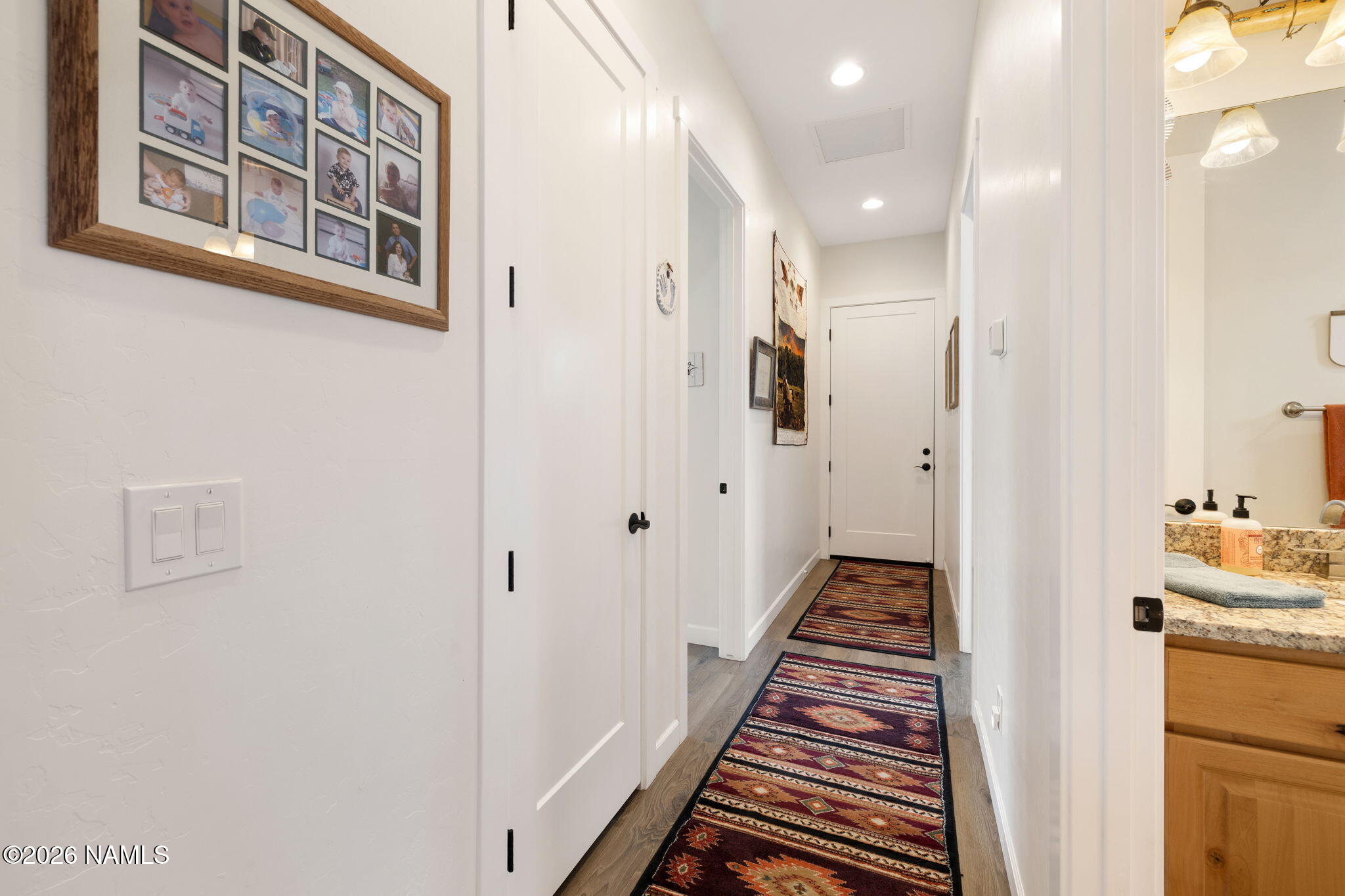 2557 Lazy E Road Williams, AZ 86046 - Photo 27 of 51 a view of a hallway with paintings on the wall