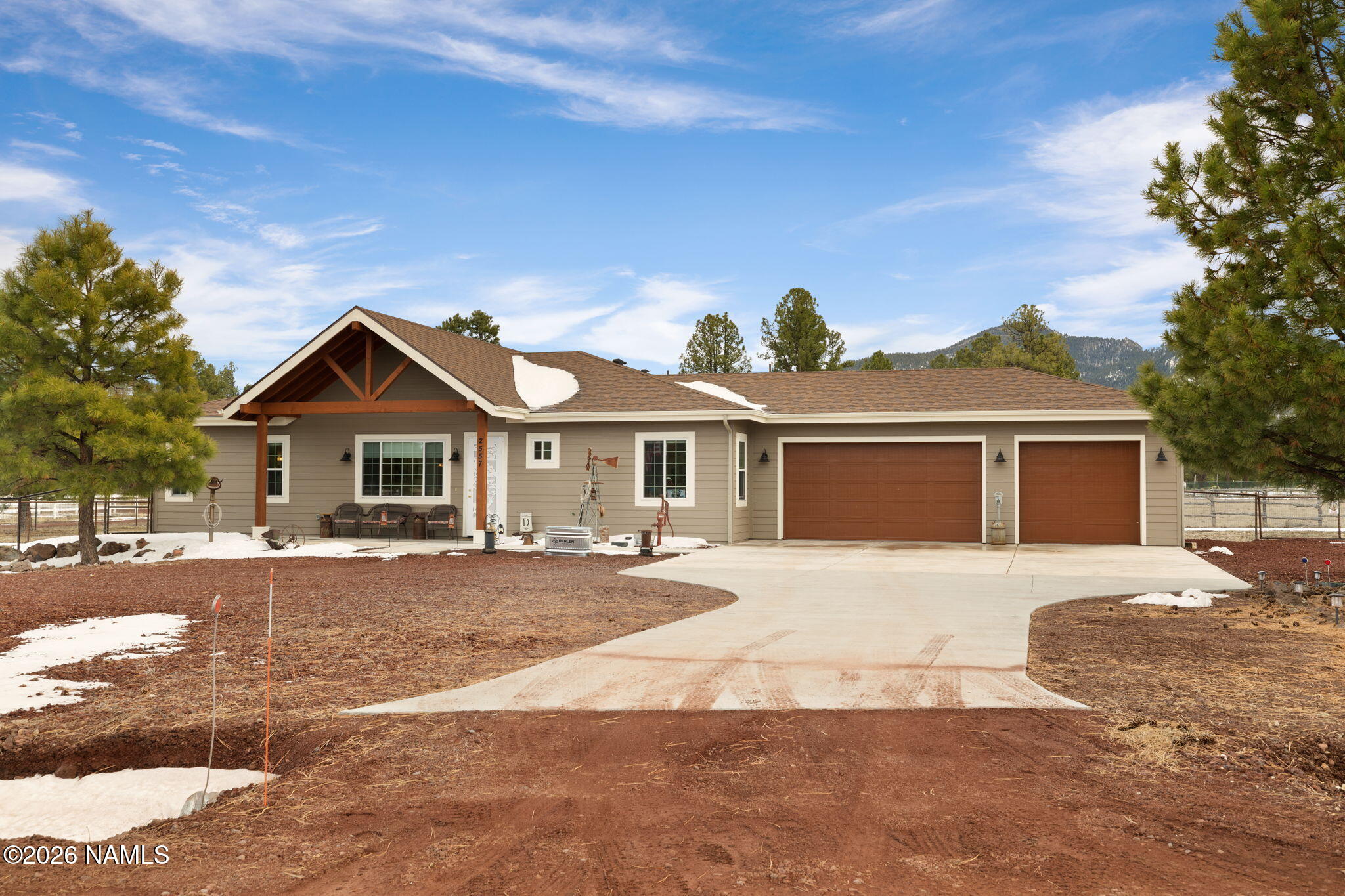 2557 Lazy E Road Williams, AZ 86046 - Photo 48 of 51 a front view of a house with a yard and garage
