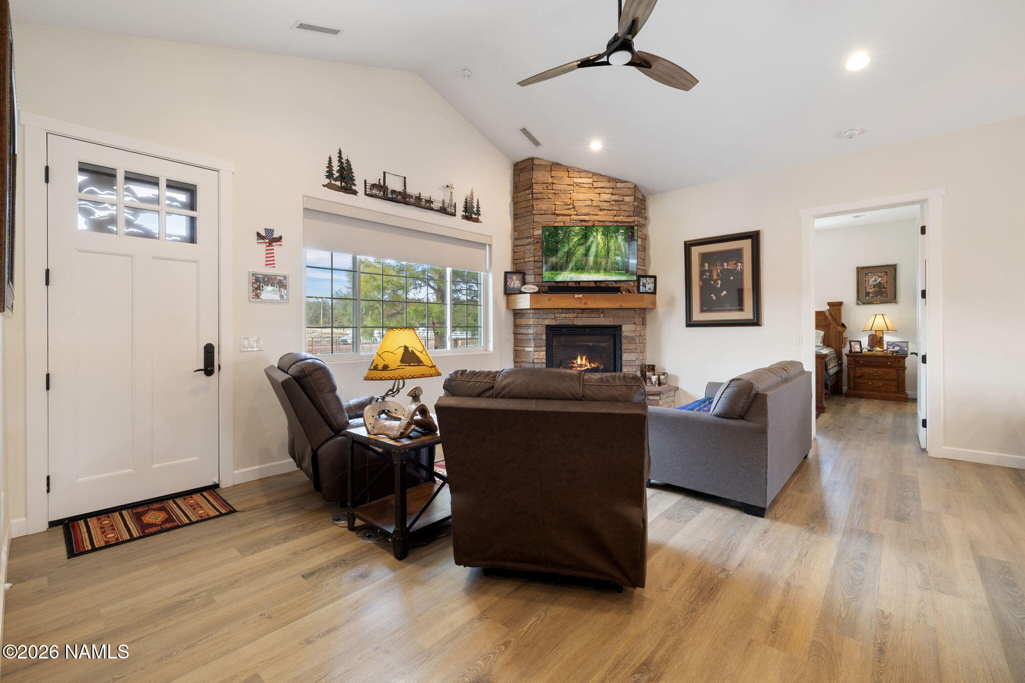 2557 Lazy E Road Williams, AZ 86046 - Photo 5 of 51 a living room with furniture and a fireplace