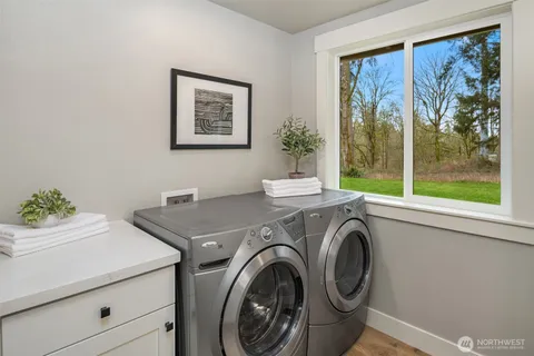 a view of livingroom with washer and dryer