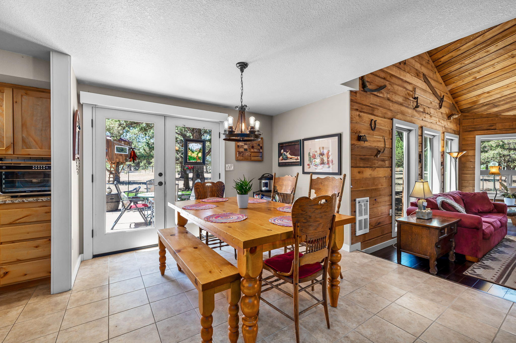 21870 Rincon Avenue Bend, OR 97702 - Photo 6 of 47 The dining area opens onto a beautiful patio and landscaped backyard for enjoying el-fresco dining under the stars.