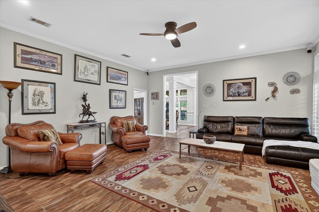 1408 West Cleburne Road Crowley, TX 76036 - Photo 11 of 40 a living room with furniture and a rug