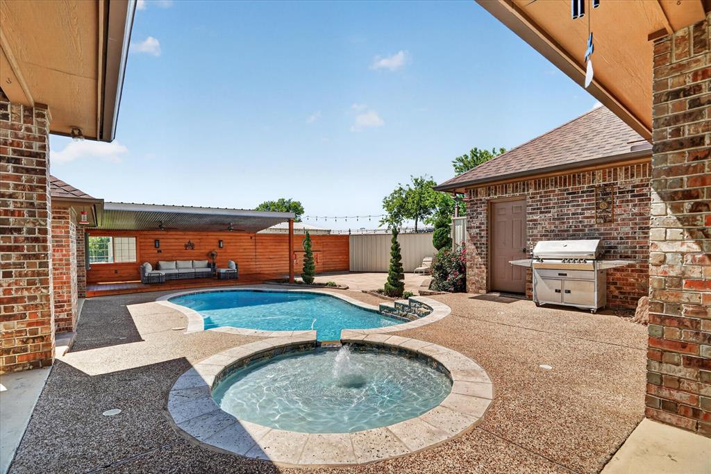 1408 West Cleburne Road Crowley, TX 76036 - Photo 31 of 40 swimming pool view with a seating space