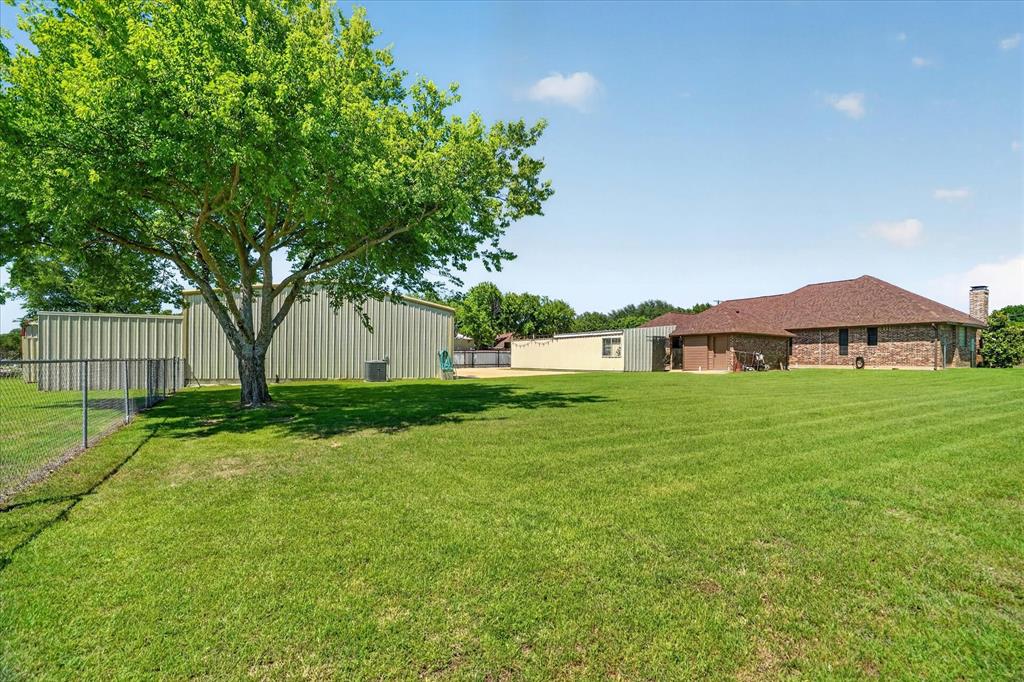 1408 West Cleburne Road Crowley, TX 76036 - Photo 40 of 40 a view of house with yard