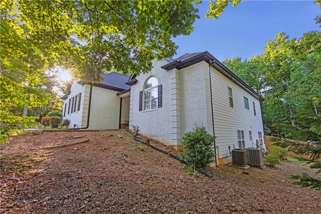 151 Dumar Lane Hoschton, GA 30548 - Photo 3 of 10 a house with trees in front of it