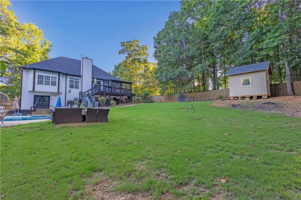 151 Dumar Lane Hoschton, GA 30548 - Photo 4 of 10 a front view of a house with a yard and a garage