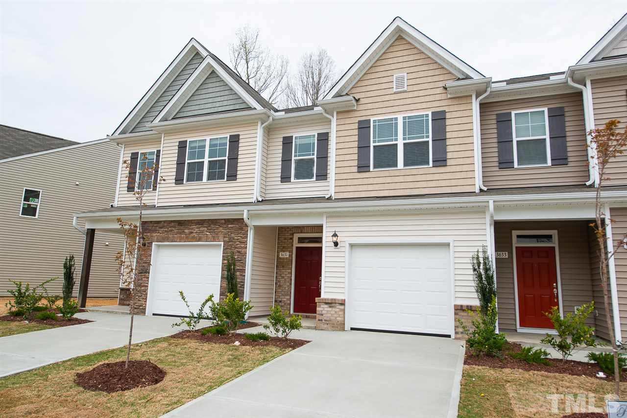 3631 Water Mist Lane, Unit 16 Raleigh, NC 27604 - Photo 1 of 28 a front view of a house with a yard and garage
