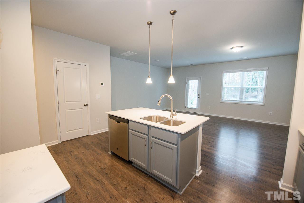3631 Water Mist Lane, Unit 16 Raleigh, NC 27604 - Photo 7 of 28 a view of a kitchen with a sink and wooden floor