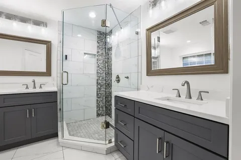 a bathroom with a granite countertop sink mirror and double
