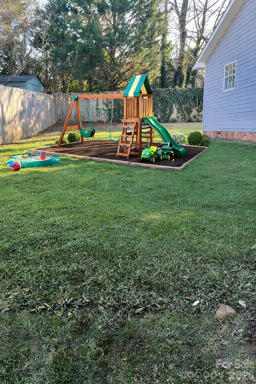 314 Tylers Way Fort Mill, SC 29715 - Photo 16 of 16 a view of a park with slide and a wooden bench