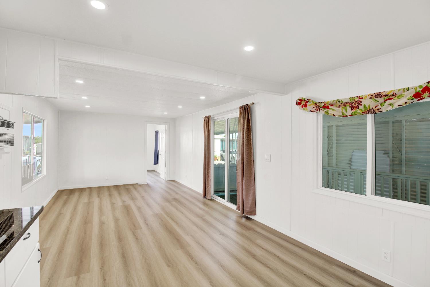 4143 Yosemite, Unit C21 Modesto, CA 95357 - Photo 17 of 25 a view of an empty room with glass door