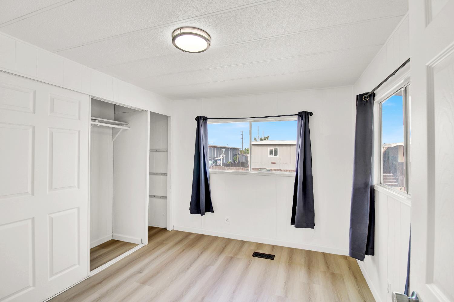 4143 Yosemite, Unit C21 Modesto, CA 95357 - Photo 18 of 25 a view of a room with wooden floor and entrance