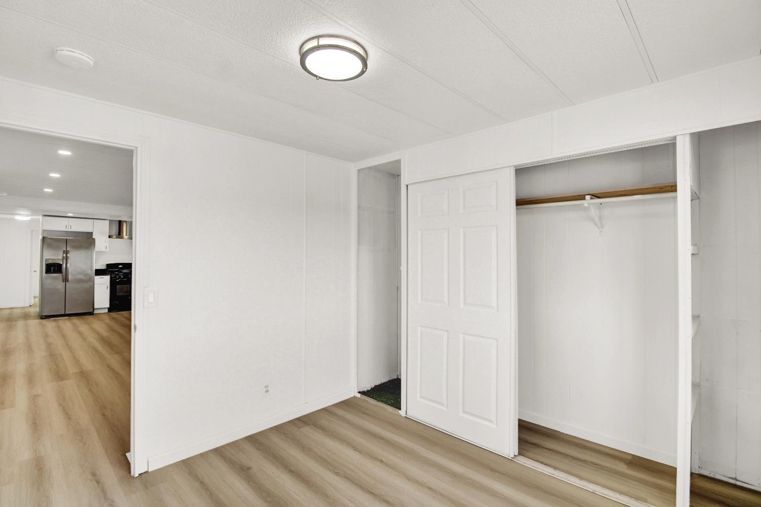 4143 Yosemite, Unit C21 Modesto, CA 95357 - Photo 20 of 25 a view of a livingroom with wooden floor