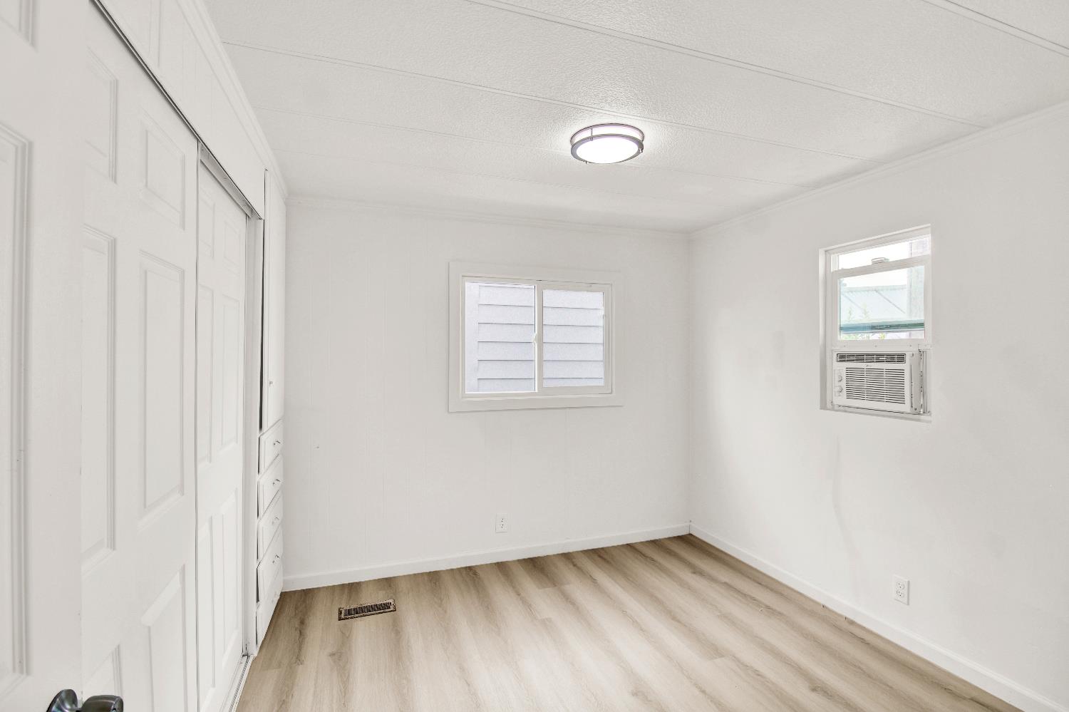 4143 Yosemite, Unit C21 Modesto, CA 95357 - Photo 23 of 25 an empty room with windows