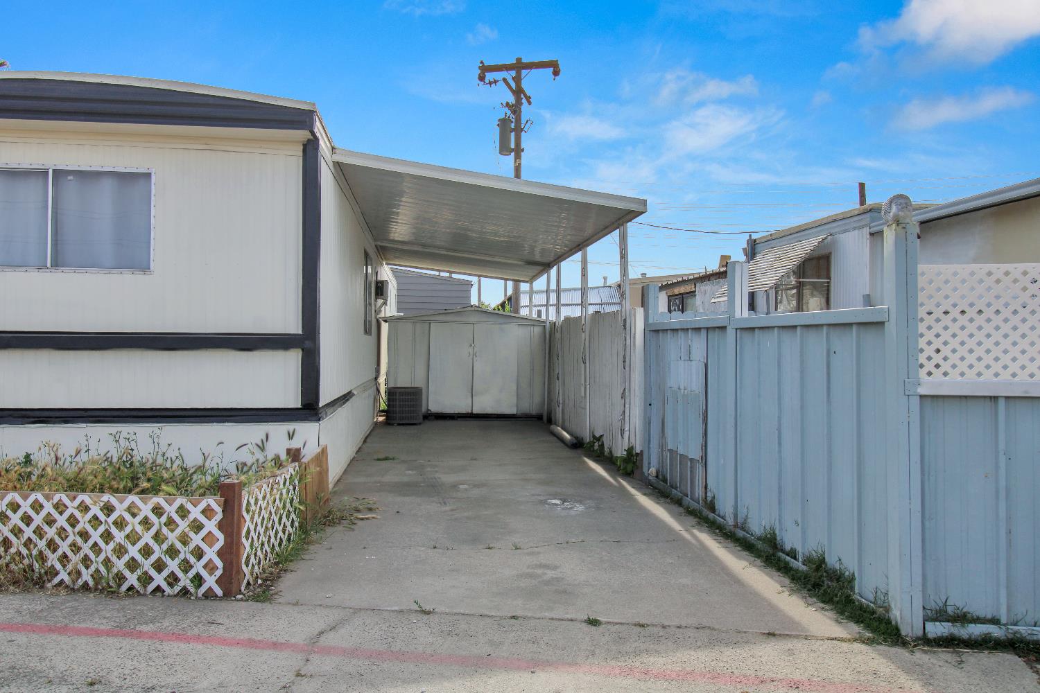 4143 Yosemite, Unit C21 Modesto, CA 95357 - Photo 7 of 25 a view of a house with a wooden fence