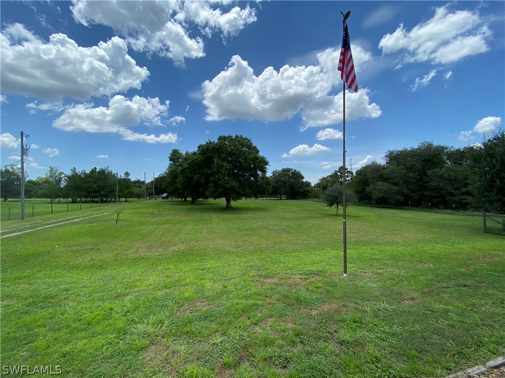 3501 Packinghouse Road Alva, FL 33920 - Photo 14 of 18 a backyard of a house with lots of green space
