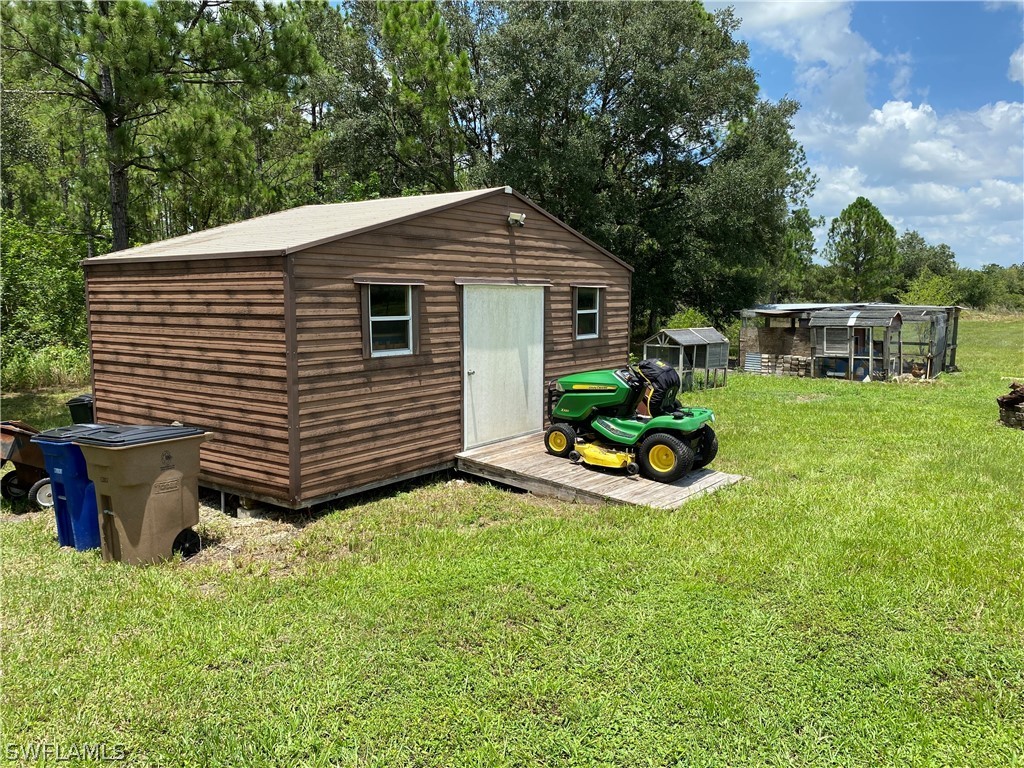 3501 Packinghouse Road Alva, FL 33920 - Photo 17 of 18 a view of a backyard with sitting area