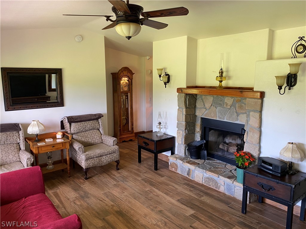 3501 Packinghouse Road Alva, FL 33920 - Photo 2 of 18 a living room with furniture and a fireplace