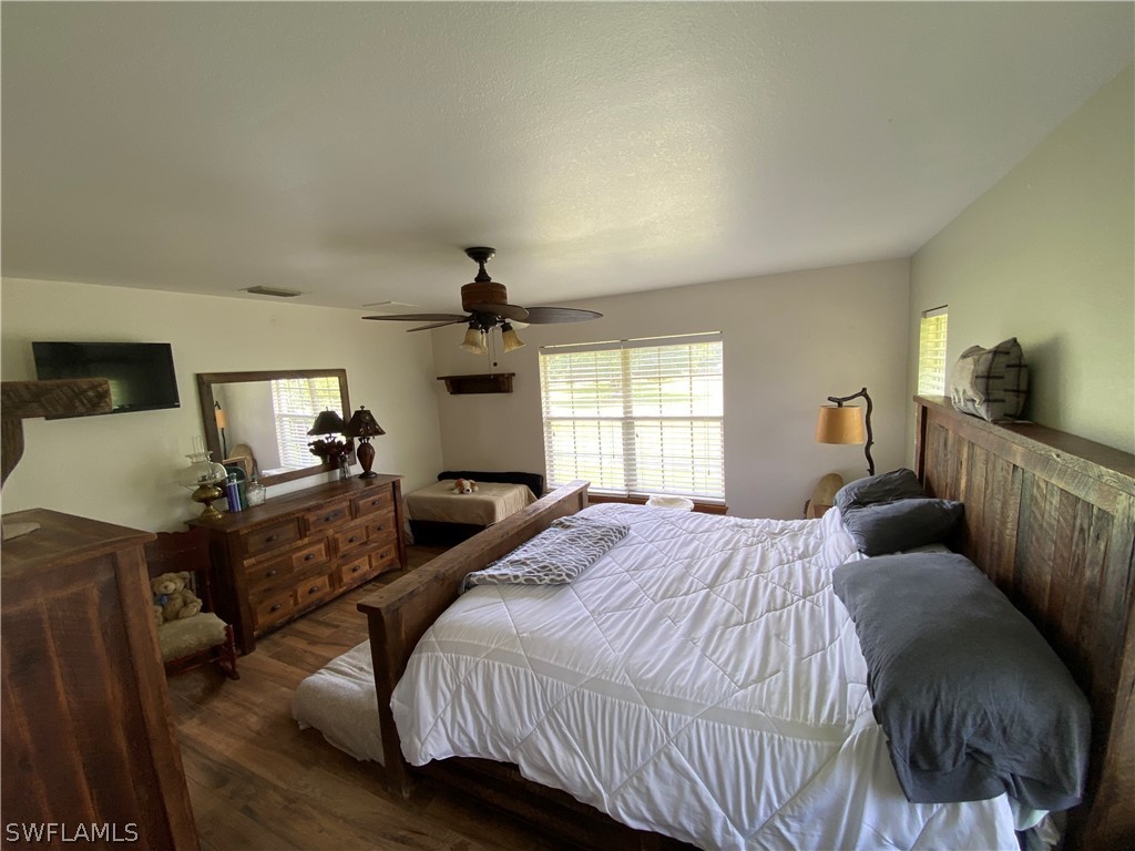 3501 Packinghouse Road Alva, FL 33920 - Photo 4 of 18 a bedroom with a bed and wooden floor