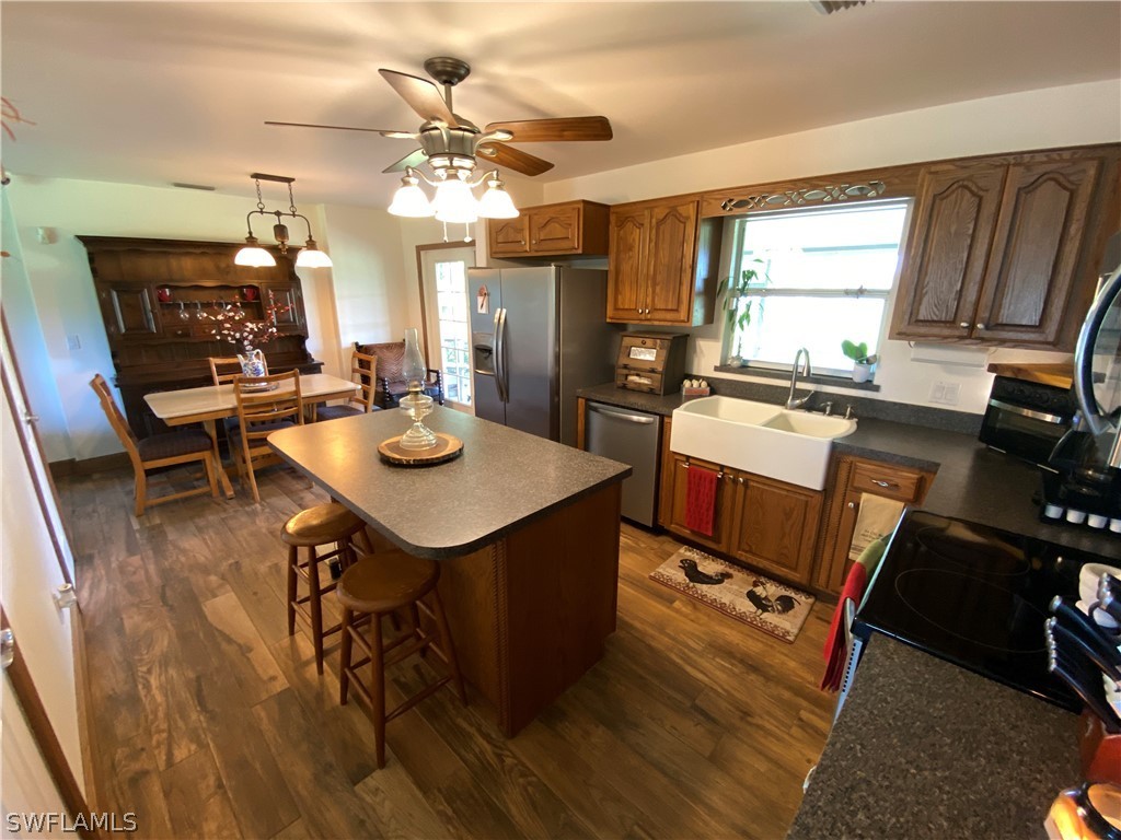 3501 Packinghouse Road Alva, FL 33920 - Photo 9 of 18 a view of a dining room with furniture and wooden floor