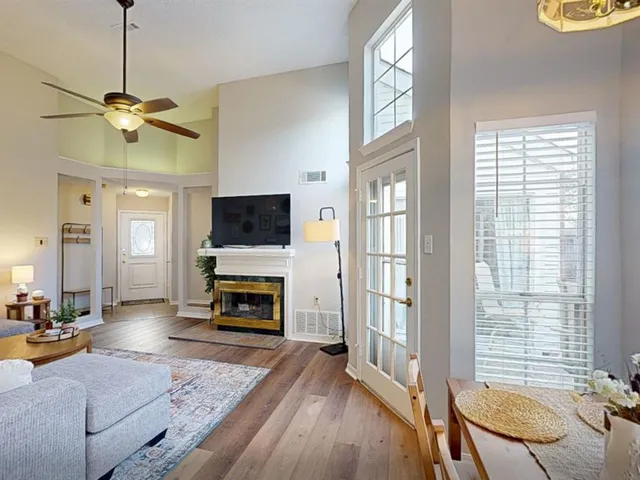 a living room with furniture fireplace and flat screen tv