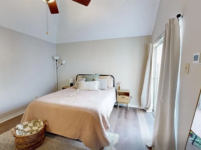 a bedroom with a bed and a chair