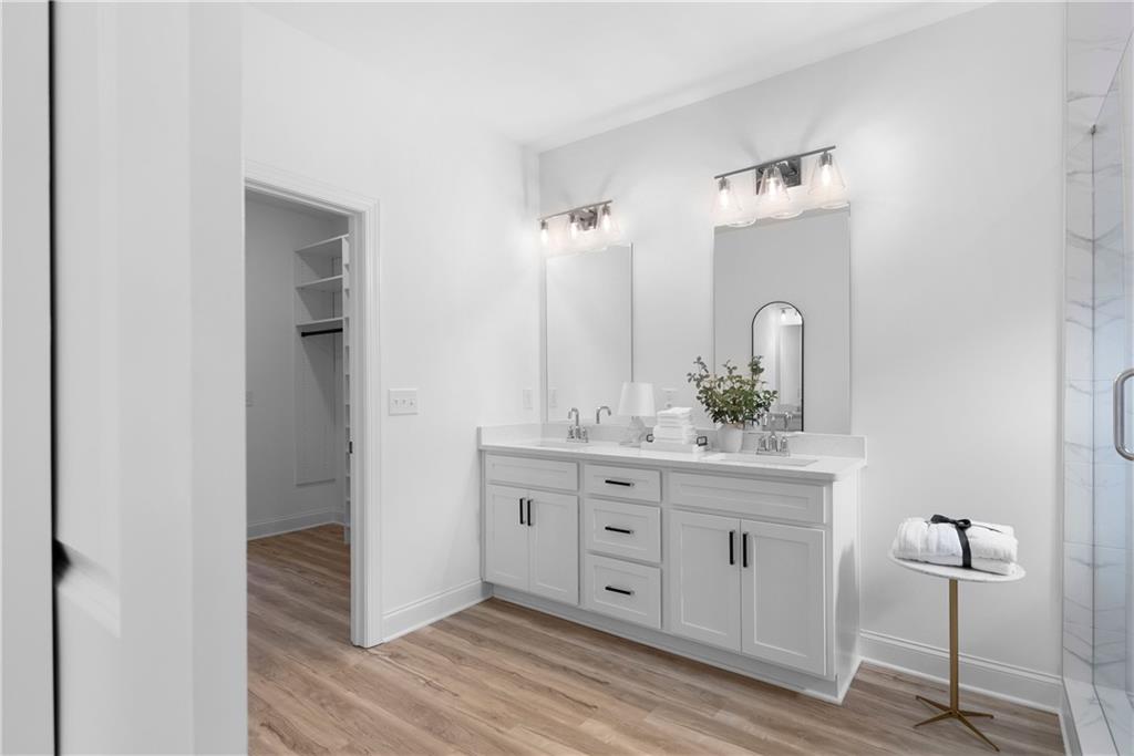 113 Waterview Court Waleska, GA 30183 - Photo 11 of 38 a bathroom with a double vanity sink and mirror