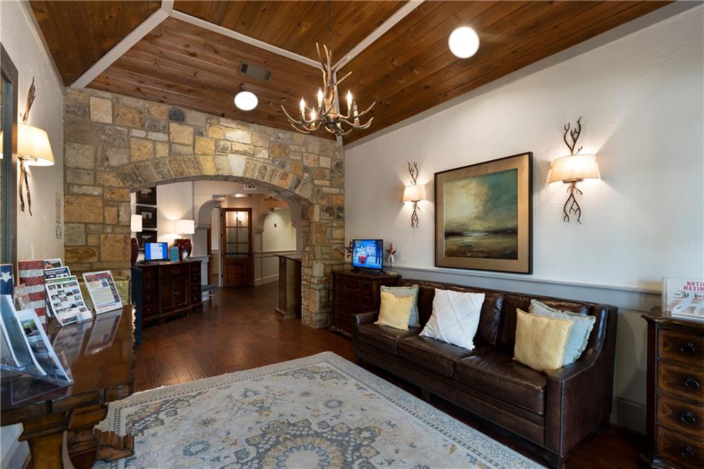 113 Waterview Court Waleska, GA 30183 - Photo 33 of 38 a living room with furniture and a chandelier
