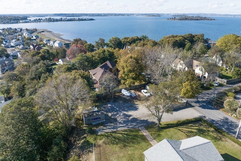 0 Prospect Avenue Hull, MA 02045 - Photo 3 of 16 a view of a lake with lawn chairs