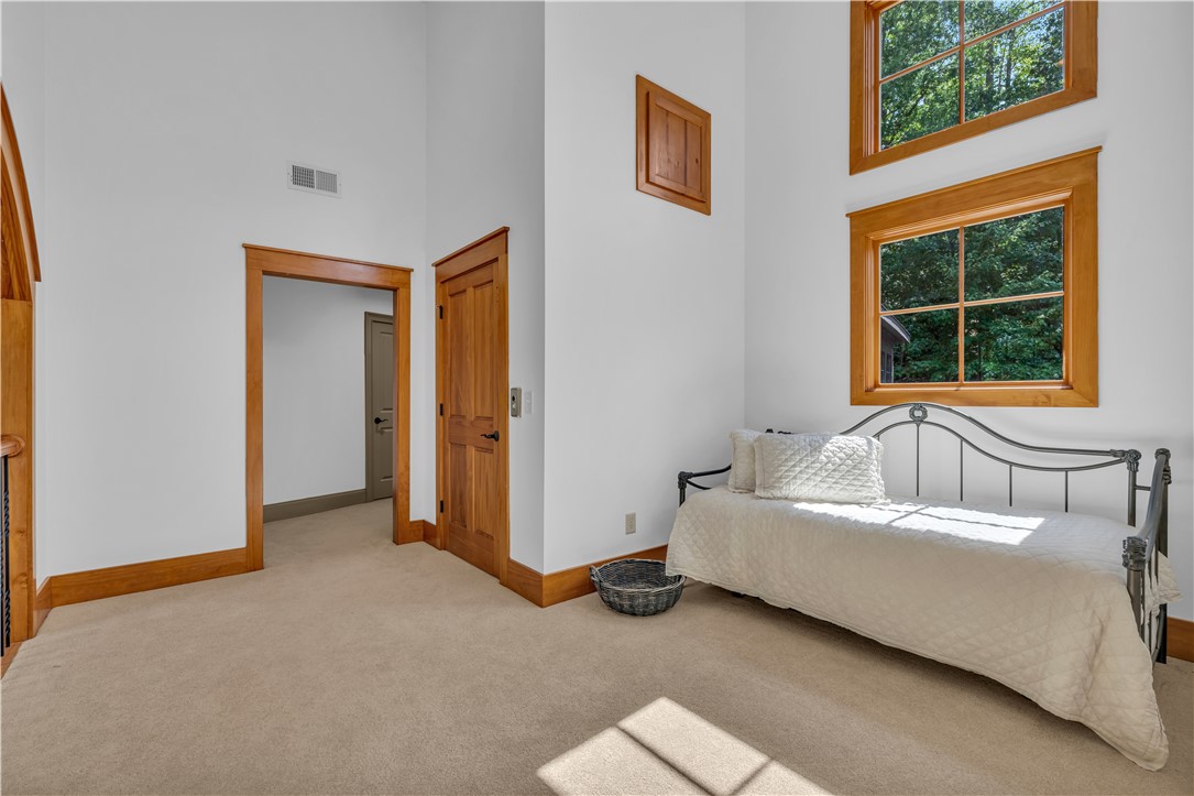 256 Talton Road Six Mile, SC 29682 - Photo 29 of 50 Towering ceilings and rich wood-framed windows elevate this airy upper-level bonus space.