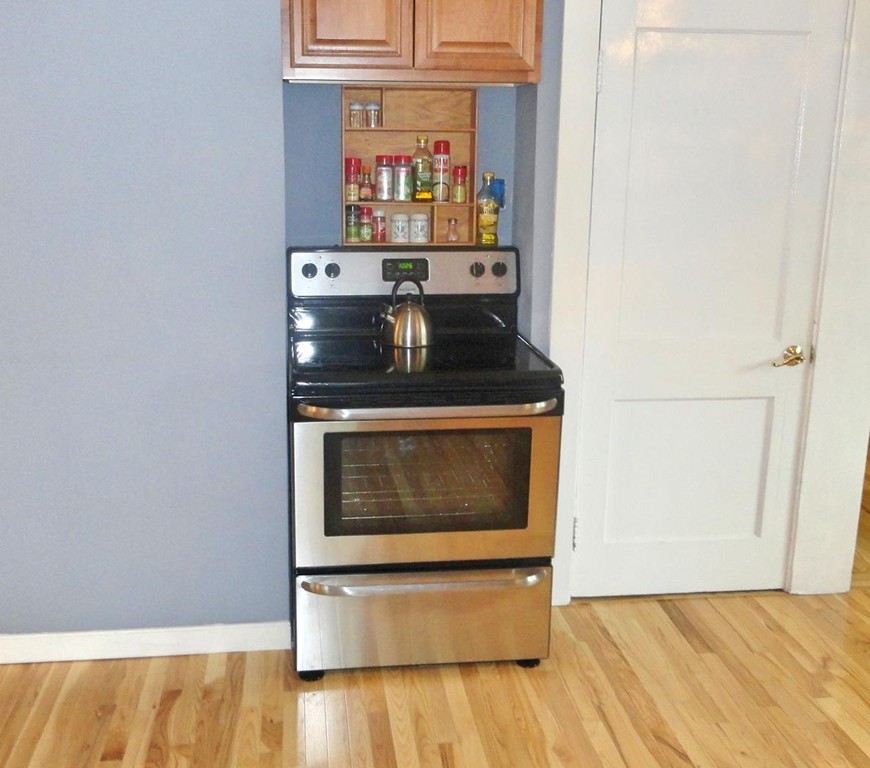 20 North Hunt Road Amesbury, MA 01913 - Photo 11 of 18 a kitchen with stainless steel appliances wooden floor and a sink