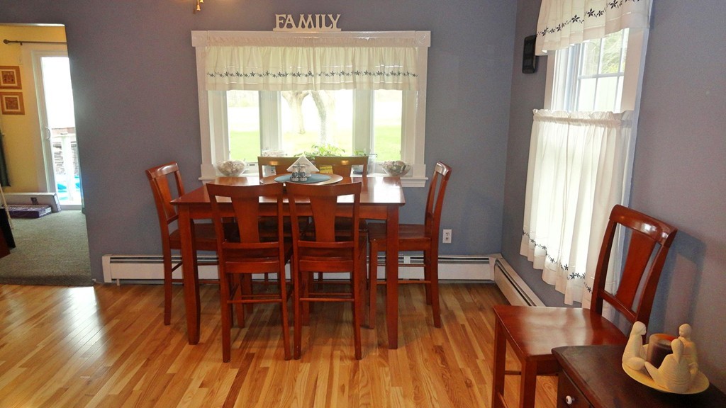 20 North Hunt Road Amesbury, MA 01913 - Photo 8 of 18 a view of a dining room with furniture window and wooden floor