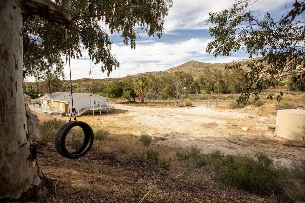 46251 Wilson Valley Road Aguanga, CA 92536 - Photo 11 of 15 a view of outdoor space with swimming pool and green space