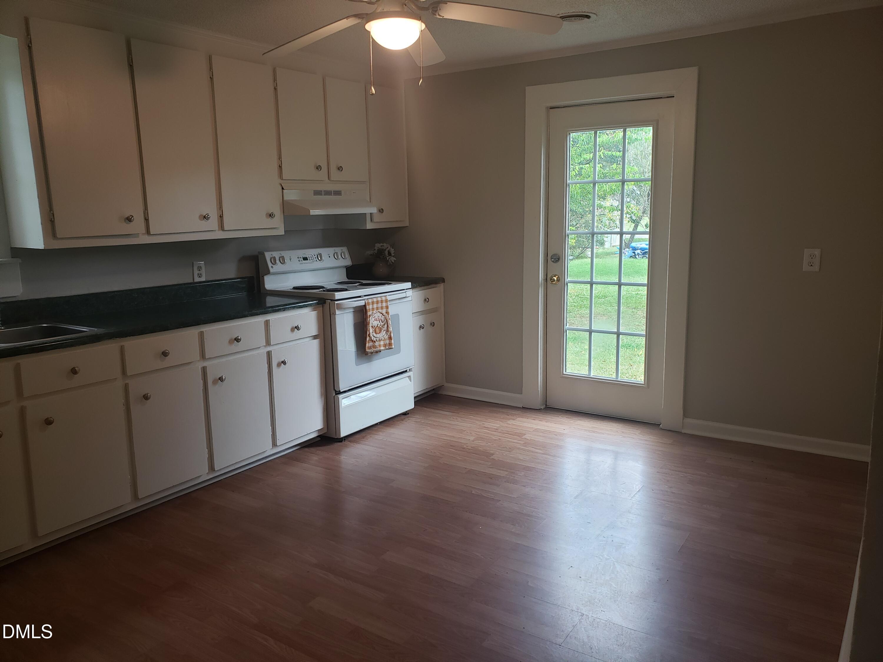 306 South Moore Street Clayton, NC 27520 - Photo 12 of 31 a view of a kitchen with electric appliances