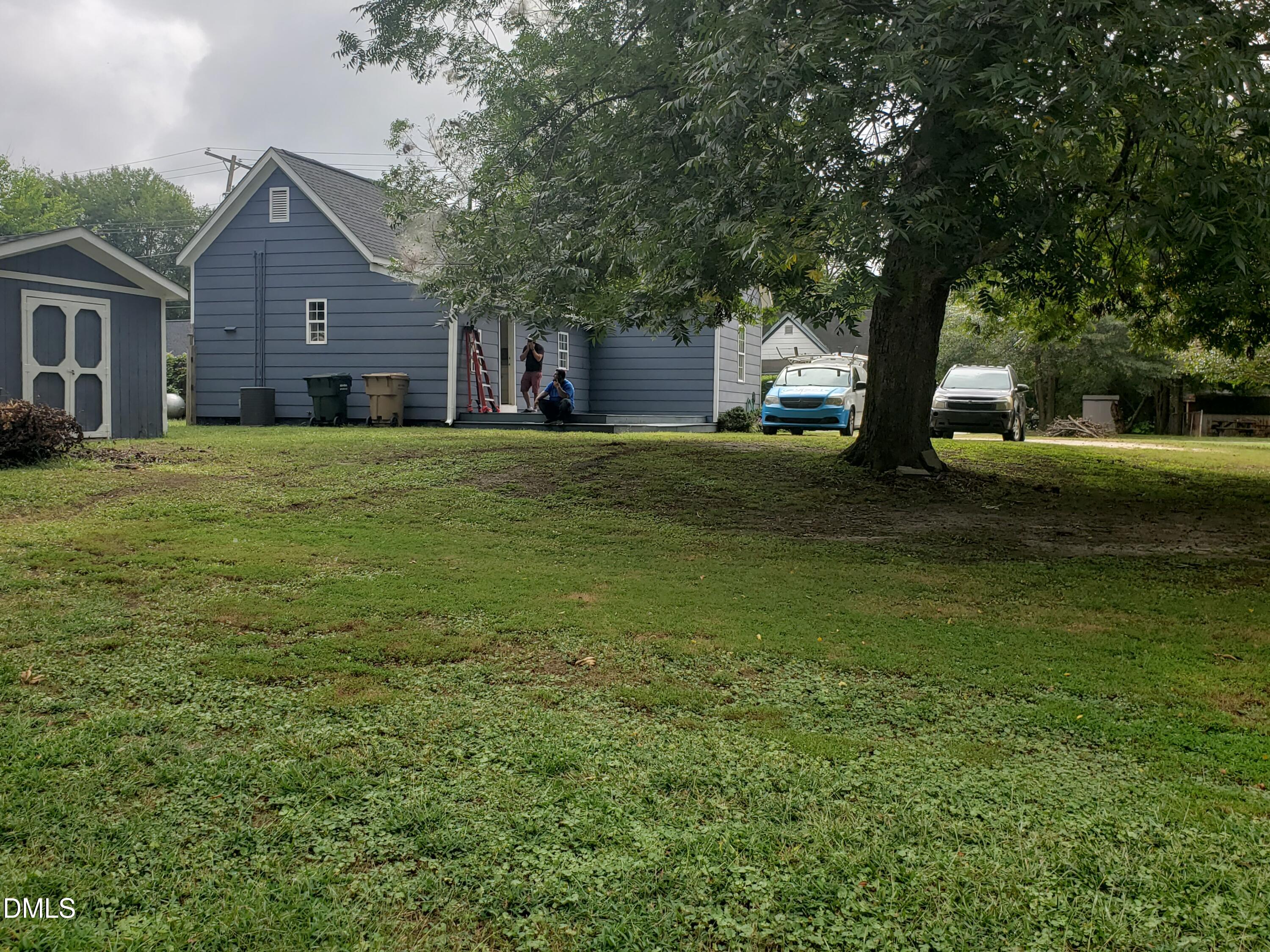 306 South Moore Street Clayton, NC 27520 - Photo 14 of 31 a front view of a house with a garden