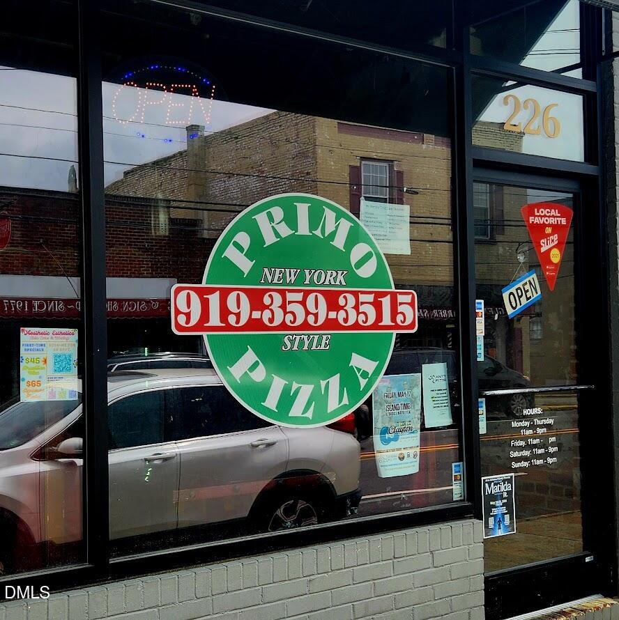 306 South Moore Street Clayton, NC 27520 - Photo 19 of 31 a view of outdoor space with seating area and small yard